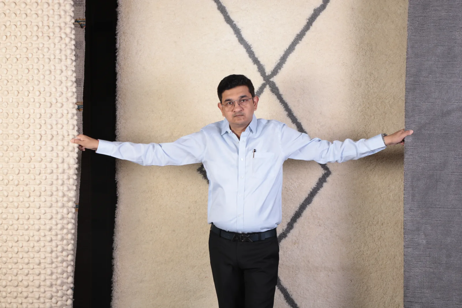 Amit N Jain with hand-knotted rugs